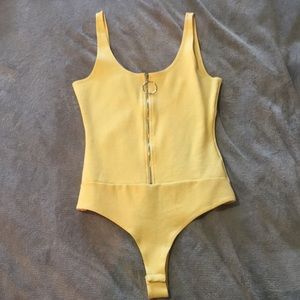 Cute yellow bodysuit with a zipper down the front